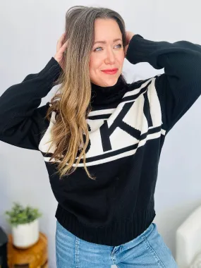 Stay Cozy in Style with the SKI Logo Turtleneck Sweater